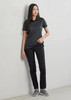 A black short sleeve polo shirt for women, paired with black trousers, featuring a logo on the left side.