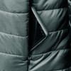A puffer jacket with a zippered pocket, containing a smartphone, in a dark colour.