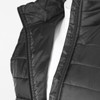 A black women's puffer vest with a zippered opening and quilted texture, displayed on a mannequin.