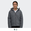 A women's puffer jacket in grey featuring a zip front and a hood, displayed on a model.