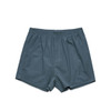 Boxer shorts in a teal colour, featuring an elastic waistband and a simple design. The item has a brand logo.
