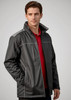 A man models a black unisex reactor jacket with grey accents, featuring zip pockets and a collar.