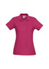 A pink ladies polo shirt with a classic collar, short sleeves, and a button placket. Features a logo on the front.