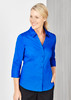 A blue button-up shirt with 3/4 sleeves worn by a smiling woman, featuring a collar and buttons down the front.
