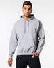 A grey hooded sweatshirt featuring a front pocket and a drawstring hood, modelled by a person.