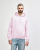 A pink Gildan Heavy Blend adult hooded sweatshirt with a front pocket and a logo.