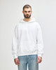 A white hooded sweatshirt with a front pocket and drawstrings, displayed on a model against a plain background.