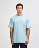A lightweight, unisex t-shirt in light blue, made from heavyweight cotton, featuring a simple design.