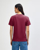 A heavyweight unisex t-shirt in burgundy, featuring a simple design and a visible logo on the back.