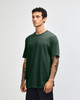 A heavyweight cotton unisex T-shirt in deep green, featuring a crew neck and short sleeves. The design includes a logo.