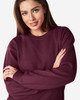 A maroon Gildan Heavy Blend adult crewneck sweatshirt with a logo, featuring a relaxed fit and long sleeves.
