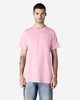 A plain pink Gildan Ultra Cotton adult T-shirt displayed on a model against a neutral background.