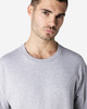 A grey Gildan Ultra Cotton adult t-shirt displayed on a model, featuring long sleeves and a round neckline.