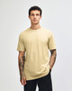 A unisex short sleeve t-shirt in a pale yellow colour, displayed on a model against a plain background.