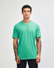 A solid mint green unisex short sleeve T-shirt on a model, featuring a logo on the chest.