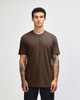 A unisex short sleeve t-shirt in brown, featuring a relaxed fit and a simple design. It has a branding logo.