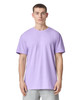 A lilac unisex CVC short sleeve T-shirt displayed on a model. The shirt features a simple design and has a logo.