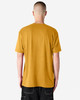 A unisex CVC short sleeve t-shirt in mustard yellow, featuring a plain back and casual fit. It has a small logo.