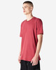 A unisex CVC short sleeve T-shirt in a rich red colour, displayed on a model in profile. It has a logo.