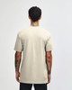 A unisex short sleeve t-shirt in a light beige colour, featuring a plain back and a logo.