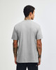 A grey unisex CVC short sleeve T-shirt viewed from the back, featuring a logo.