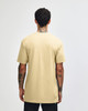 A unisex short sleeve t-shirt in a light beige colour, featuring a plain back and relaxed fit.