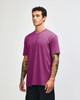 A unisex short sleeve T-shirt in vibrant pink, featuring a simple design and a small logo.