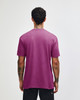 A unisex short sleeve T-shirt in bright pink, featuring a plain back and casual fit. Includes a logo.