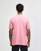 A pink unisex short sleeve T-shirt with a plain back and a subtle logo.