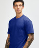 Unisex CVC short sleeve t-shirt in a vibrant blue colour, featuring a logo on the front.