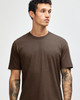 Unisex short sleeve t-shirt in brown, featuring a simple design and a logo on the fabric.