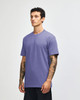 A unisex short sleeve t-shirt in a light purple hue, displayed on a model in a neutral background.