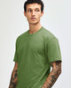 A unisex short sleeve T-shirt in olive green, featuring a simple design and no visible logos.