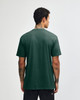 A unisex short sleeve t-shirt in dark green, featuring a plain back and a simple design.