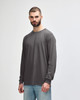 A grey long sleeve t-shirt designed for adults, featuring a crew neck and a simple, unadorned style.