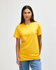 A model wearing a bright yellow Gildan Heavy Cotton adult T-shirt, standing against a plain white background.