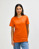 An orange Gildan Heavy Cotton Adult T-Shirt worn by a model with a plain background. The shirt has a logo.