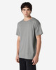A grey Gildan Heavy Cotton adult t-shirt displayed on a model, featuring a simple design and a logo.
