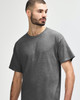 A grey Gildan Heavy Cotton Adult T-Shirt displayed on a model, featuring a simple design and a logo.