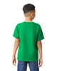 A green youth t-shirt with short sleeves, viewed from the back, worn by a child. It features a logo.