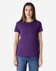 A purple Gildan Heavy Cotton Ladies' T-Shirt is displayed on a model, featuring short sleeves and a round neckline.