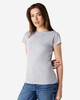A grey Gildan Softstyle ladies' T-shirt, featured on a model, styled with blue jeans. The shirt has a logo.