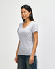 A grey Gildan Softstyle ladies' V-neck T-shirt displayed on a model, featuring short sleeves and a relaxed fit.