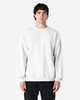A white Gildan Softstyle adult sweatshirt on a model, featuring long sleeves and a crew neckline.