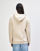 A unisex hooded sweatshirt in a neutral beige colour, featuring a logo on the back.