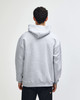 A unisex hooded sweatshirt in grey, featuring a hood and a relaxed fit with a branding logo.