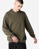 A unisex hooded sweatshirt in olive green with a front pocket and a logo. The model is wearing it casually.