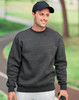 A dark grey crew neck fleece sweatshirt with a relaxed fit, worn by a man outdoors, paired with a cap.