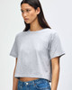 A grey boxy T-shirt made from fine jersey fabric, featuring short sleeves and a casual fit.