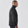 A black men's jacket featuring a high collar and zip, with a side profile view. It has a logo on the sleeve.